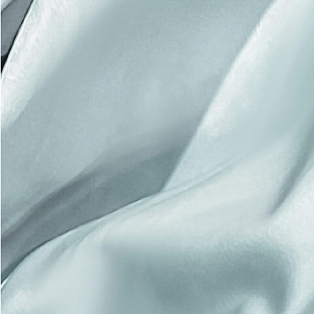 Tissu du drap-housse aspect satiné vert menthe en gros plan