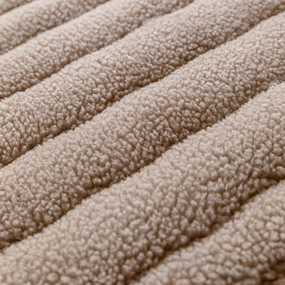 Gros plan sur la peluche matelassée café au lait