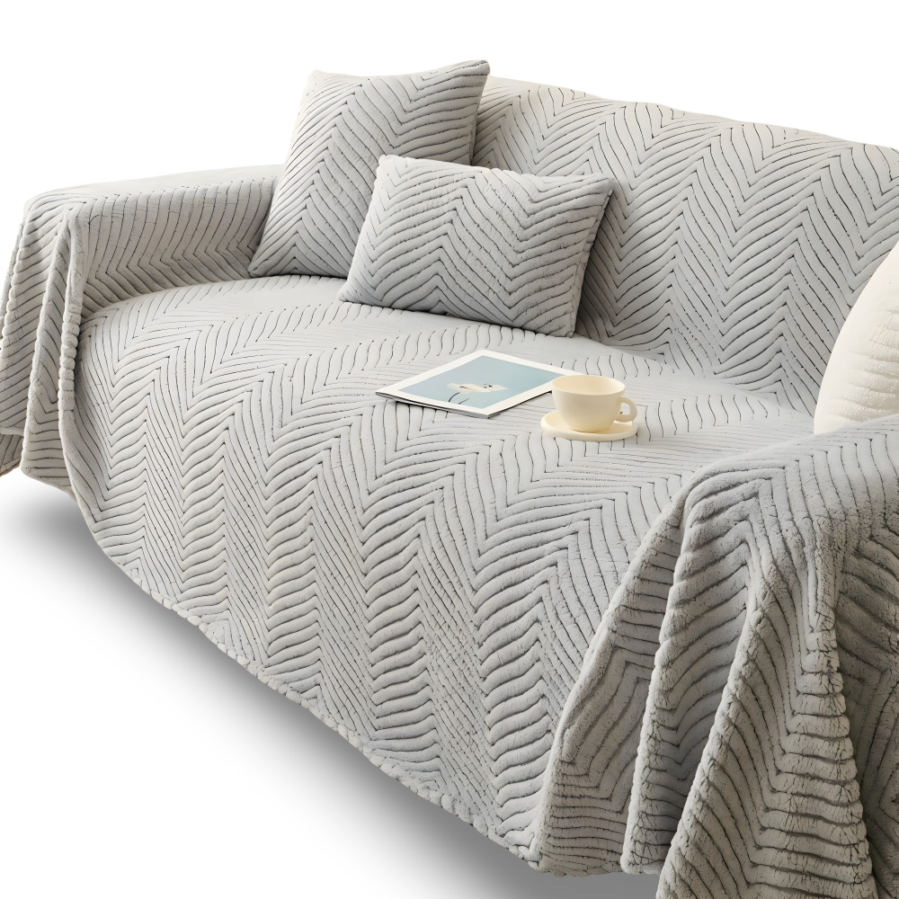 Plaid canapé gris à motif chevron sur fond blanc